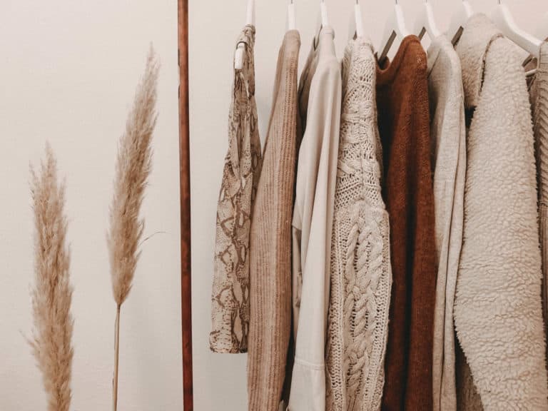 clothes on hangars in neutral tones