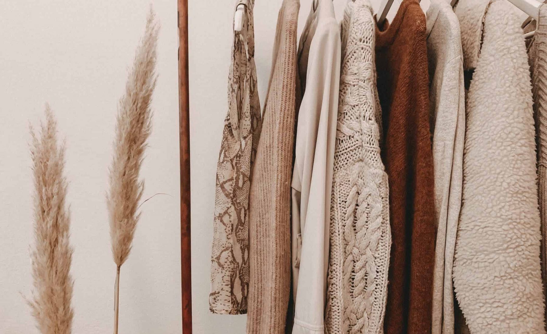 clothes on hangars in neutral tones